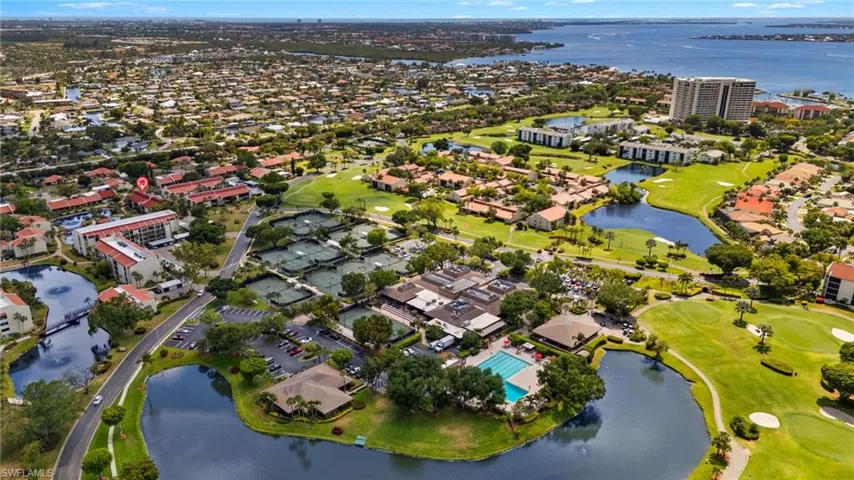 Bird's eye view with a residential view, golf course view, and a water view