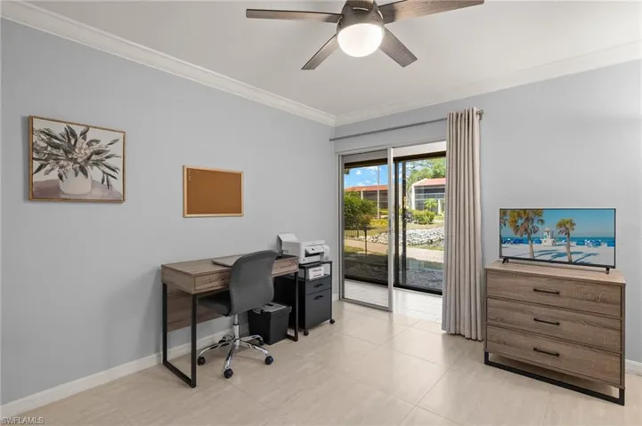 Home office featuring baseboards, ornamental molding, and a ceiling fan