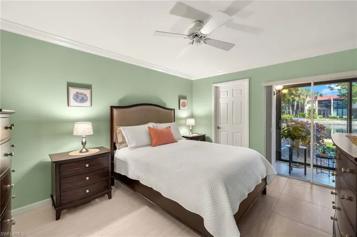 Bedroom featuring baseboards, ornamental molding, access to outside, and ceiling fan