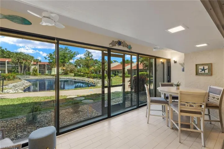 Sunroom with a water view