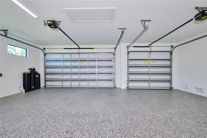 Garage featuring a garage door opener