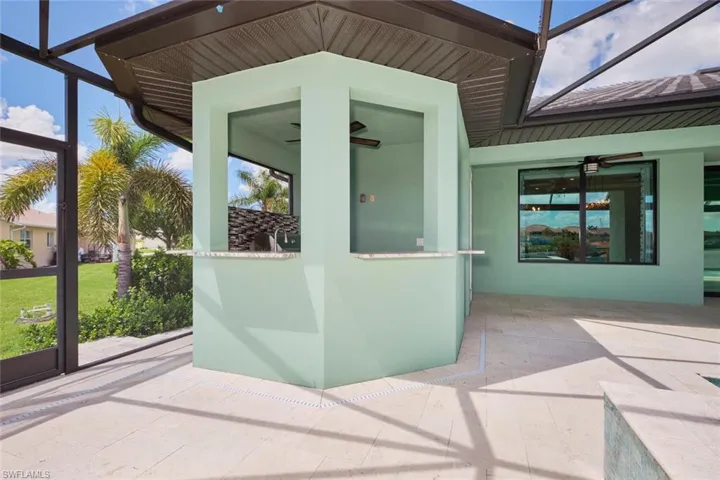 Unfurnished sunroom with a ceiling fan