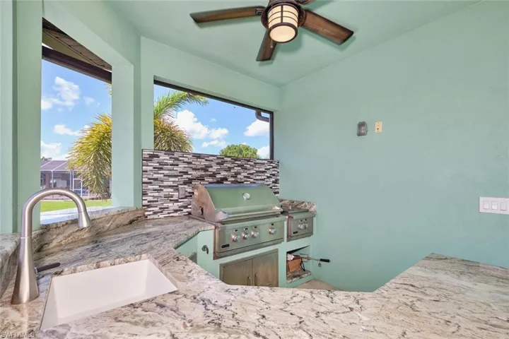 Bedroom featuring a sink and ceiling fan