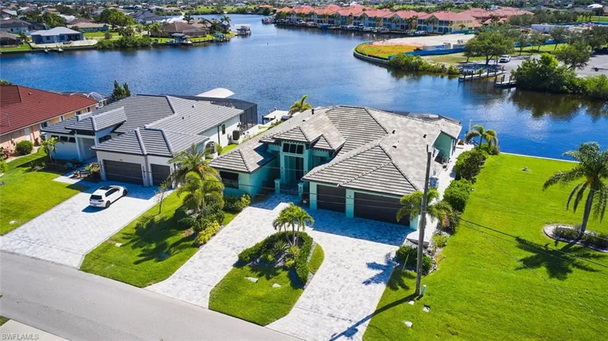 Aerial view of residential area featuring a large body of water