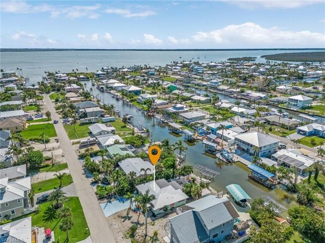 Current aerial of home with Sanibel in background.