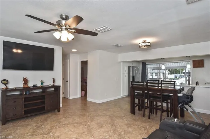 Dining space featuring baseboards, a ceiling fan, and visible vents