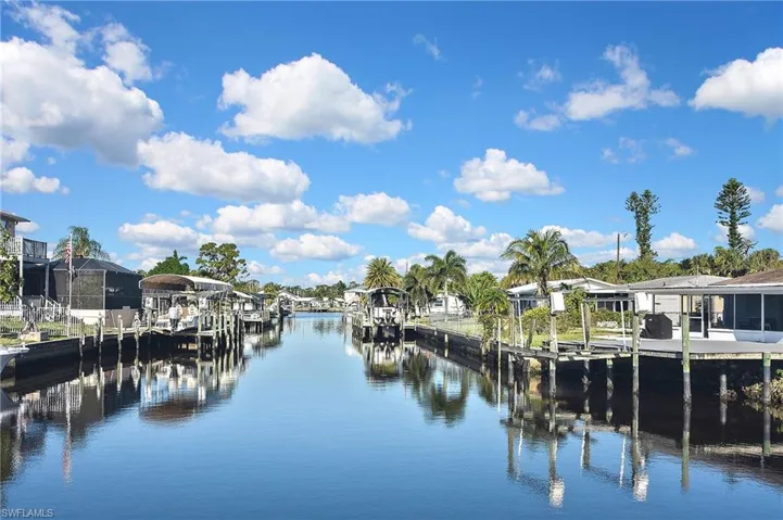 Dock area featuring a water view and boat lift