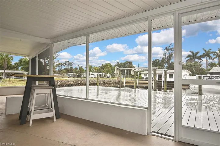 Unfurnished sunroom featuring a water view