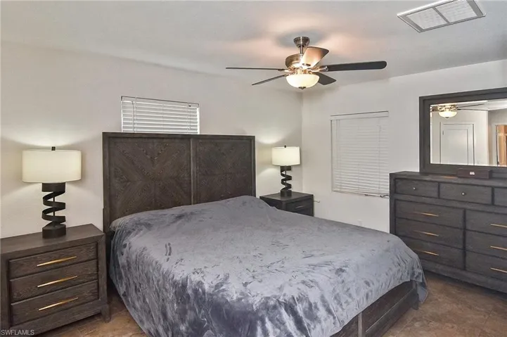 Bedroom featuring a ceiling fan and visible vents