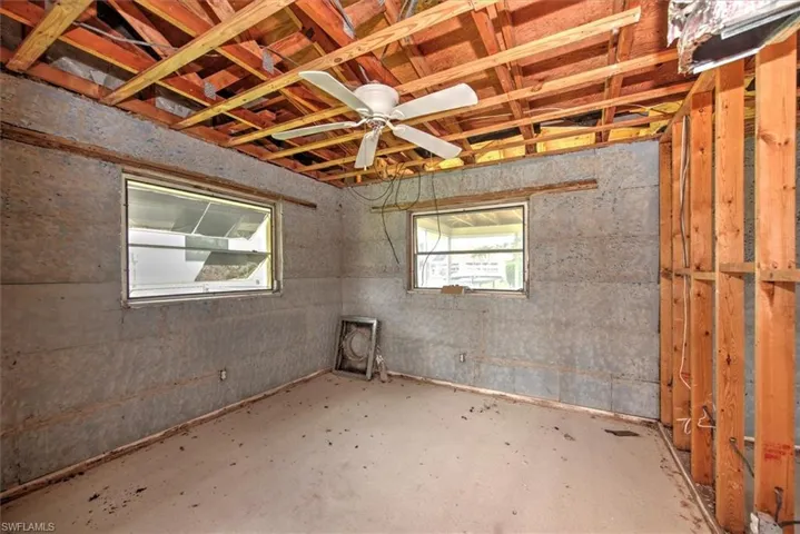 Basement featuring ceiling fan