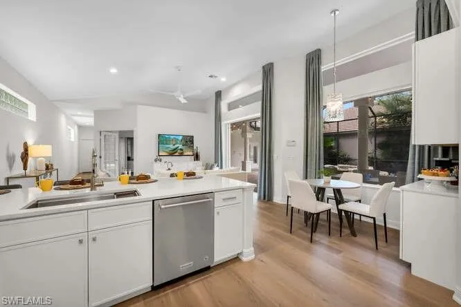 Kitchen offers counter dining or breakfast nook to enjoy pool view