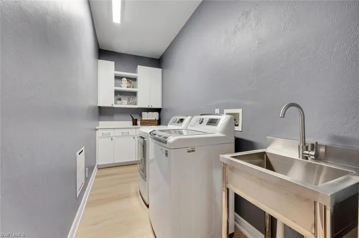 Who knew laundry day could look this good? With brand-new cabinets and counters, this laundry room is so stylish it almost makes doing chores fun—almost.