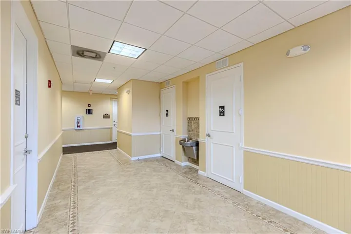 Hall with a paneled ceiling
