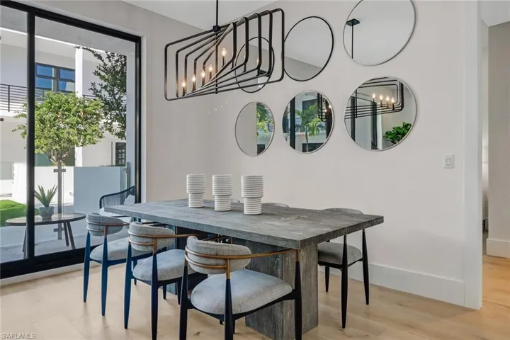 Dining room with a chandelier and light wood-style floors