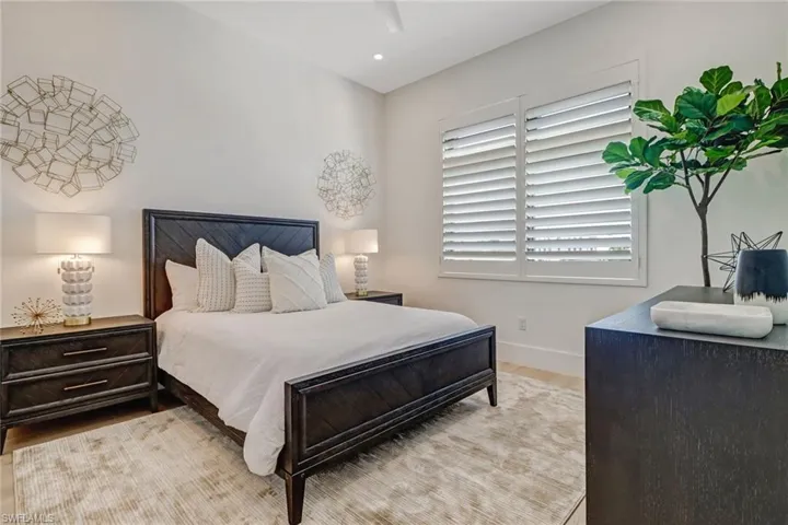 Bedroom with light wood-type flooring and ceiling fan