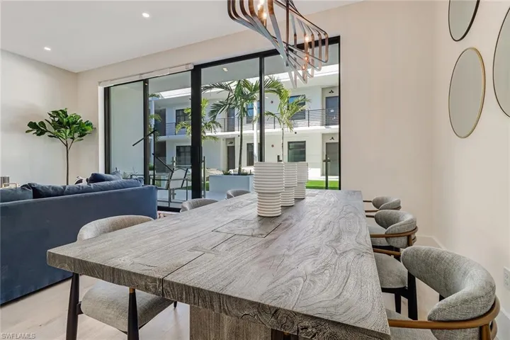 Dining room featuring light wood-style floors and recessed lighting