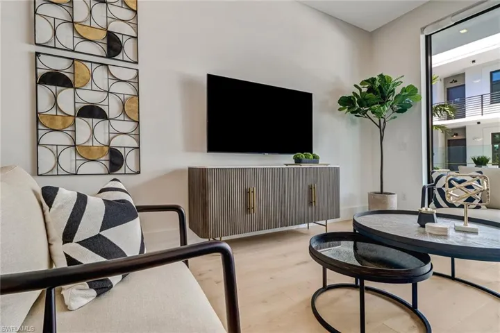 Living room featuring wood finished floors and baseboards