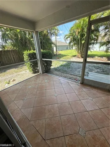 Screened lanai featuring tile flooring with decorative inlay