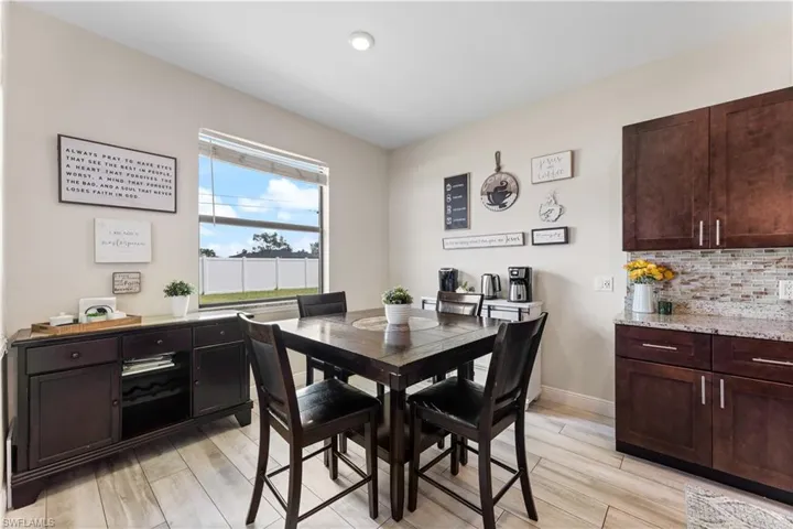 Dining room with light wood-style floors and baseboards