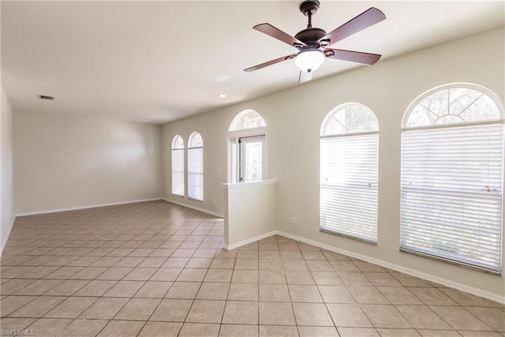 LIVING ROOM/GAME ROOM TO THE LEFT & FORMAL DINING ROOM AREA IN THE FOREGROUND! THIS HOME IS UNBELIEVABLE!