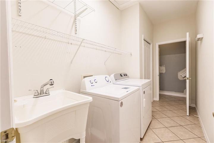 LAUNDRY ROOM IS CONVENIENTLY LOCATED IN THE HOME! DRYER IS NEW & THE WASHER IS 1 YEAR OLD! THE LAUNDRY TUB IS AN ADDED BONUS!