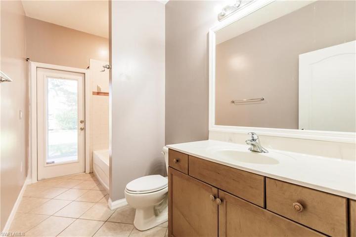 FULL GUEST BATHROOM FOR ALL TO ENJOY!  NOTE THE DOOR OUT TO THE LANAI! GREAT FEATURE WHEN ENTERTAINING OUTDOORS!