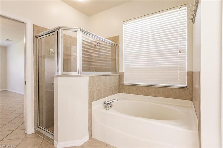 THE MASTER BATHROOM HAS BOTH A SHOWER & SOAKING TUB TO ENJOY!