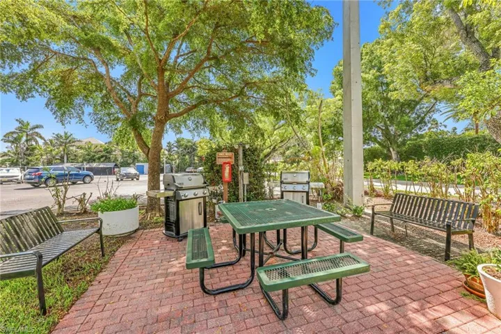 View of patio featuring outdoor dining space and grilling area