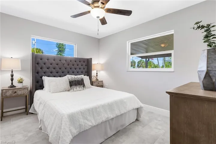 The Primary Bedroom is the perfect size & the wood plank tiles look so nice in the space.