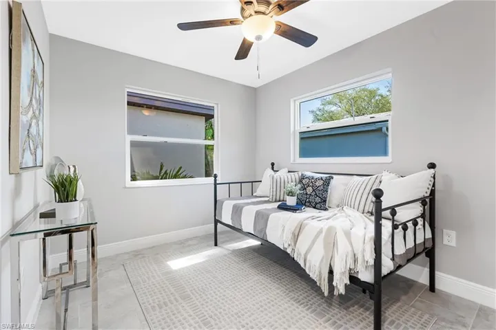 This Guest Bedroom is just the right size & even has a view of its own private oasis beyond the window with water views