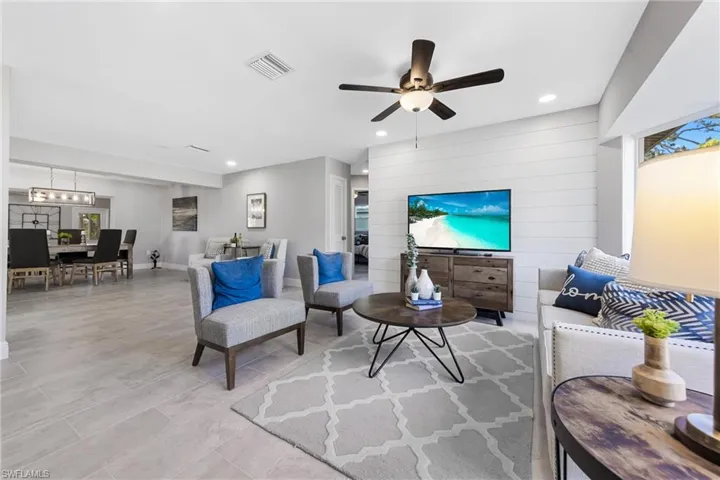 Living Room flows into the Dining Room, Seating Area & Kitchen.