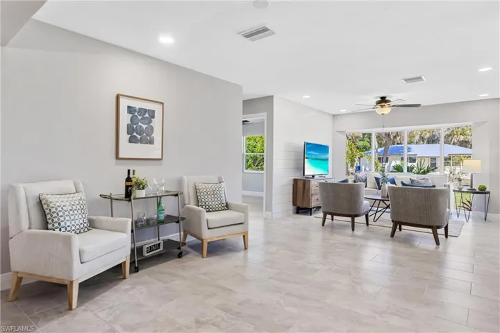 The Seating area is just off the Living Room & Kitchen & could easily be utilized as a Nook Area if desired.