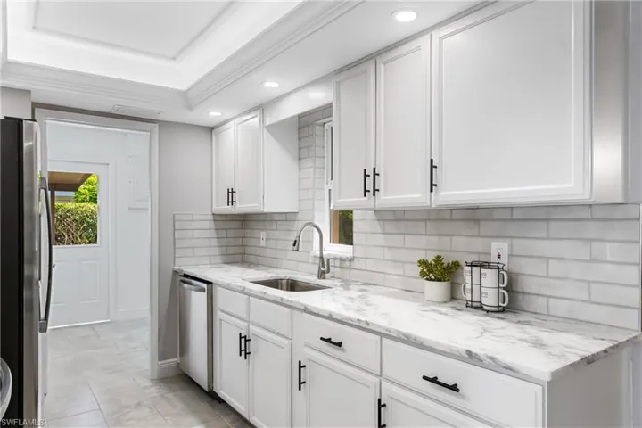 There is a gorgeous Subway Tile Backsplash & 6 New 4" LED Recess Lights