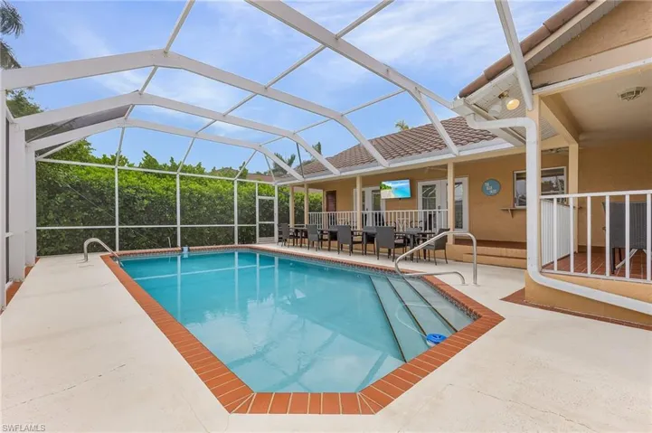 View of pool featuring a patio and a lanai