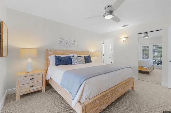 Bedroom featuring ceiling fan, a closet, and carpet flooring