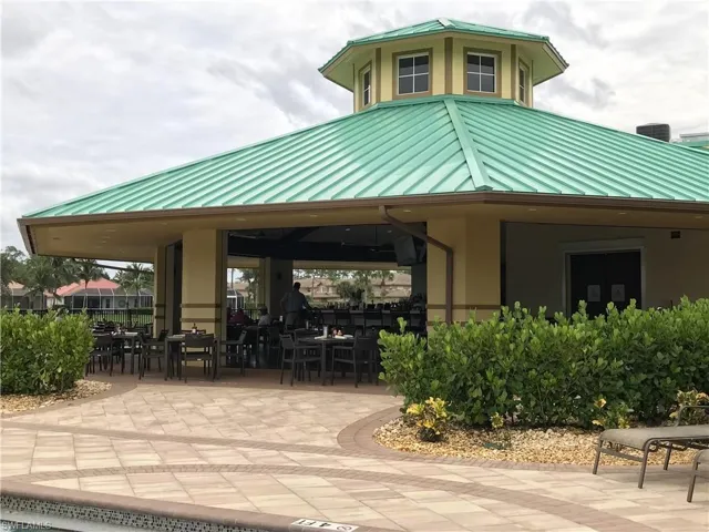 Surrounding community featuring outdoor dining area and a patio