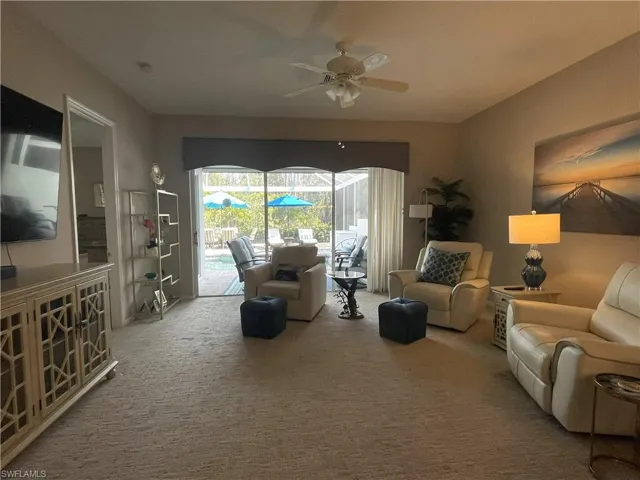 Large open living room  area looking towards pool area