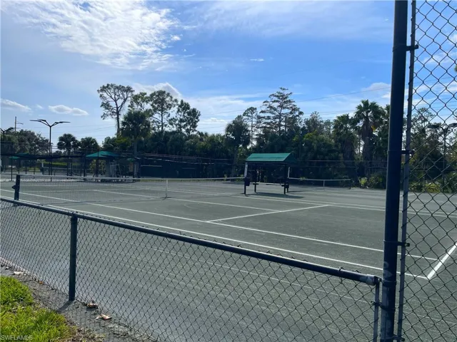 View of tennis court with community basketball court