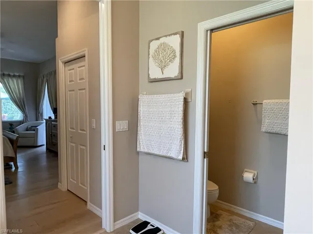Master bathroom looking at door to large walk in  closets