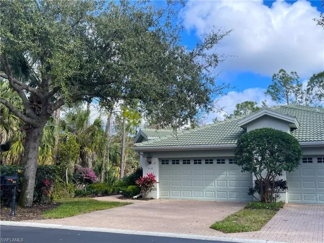 Welcome to 3532 Periwinkle -view of front of house featuring a tiled roof, stucco siding, and decorative driveway