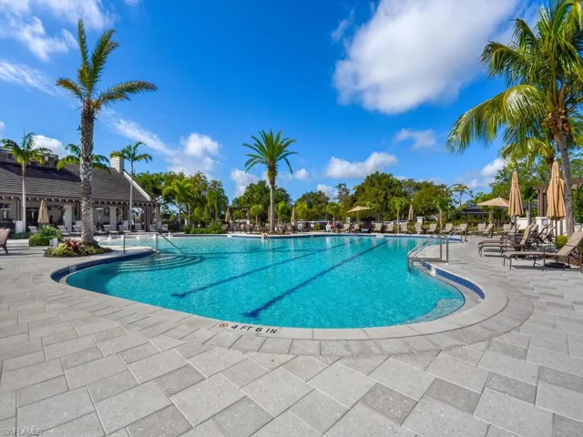 Community pool featuring a patio