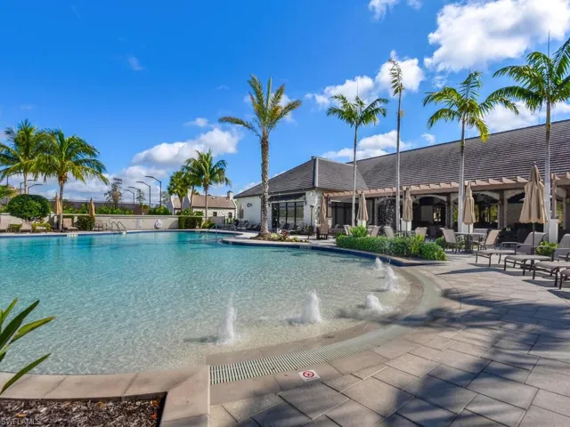Community pool with a patio