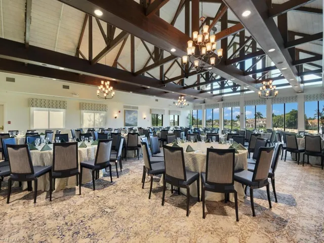 Dining room featuring a chandelier, beamed ceiling, high vaulted ceiling, and recessed lighting