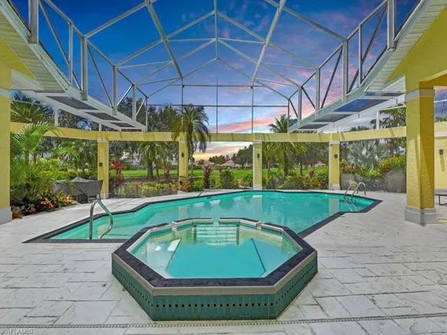 View of swimming pool featuring a pool with connected hot tub and a patio area