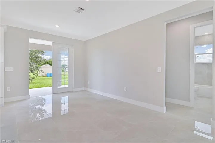 Unfurnished room with crown molding and recessed lighting