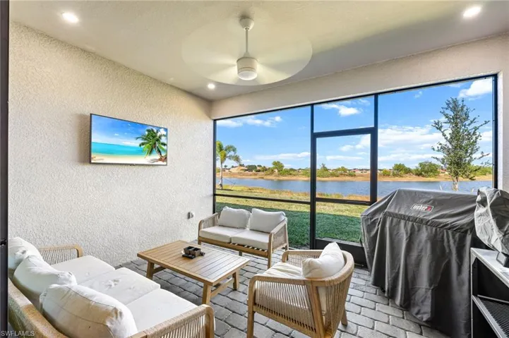 Sunroom featuring an outdoor living space and ceiling fan