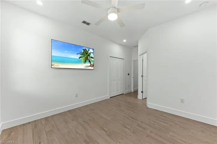 Spare room with light wood-style floors, recessed lighting, and a ceiling fan