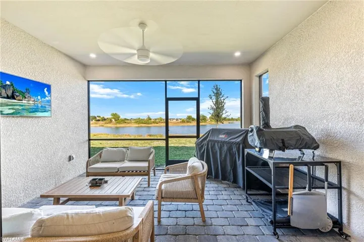 Sunroom / solarium with a water view