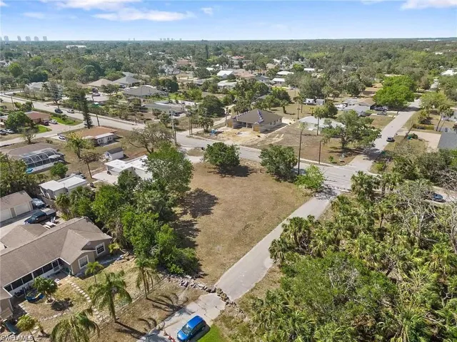 Expansive land parcel featuring existing street access and mature tree coverage