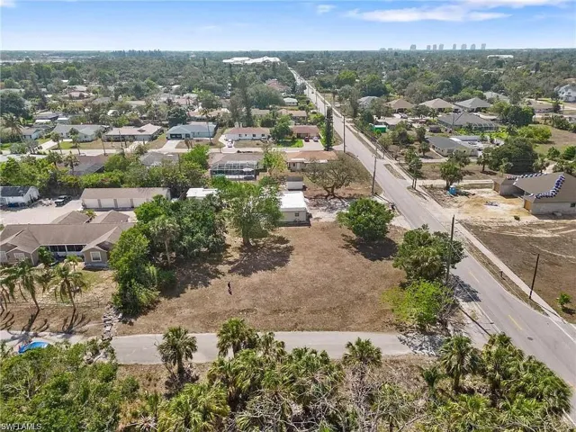 Expansive cleared land parcel with direct paved road frontage